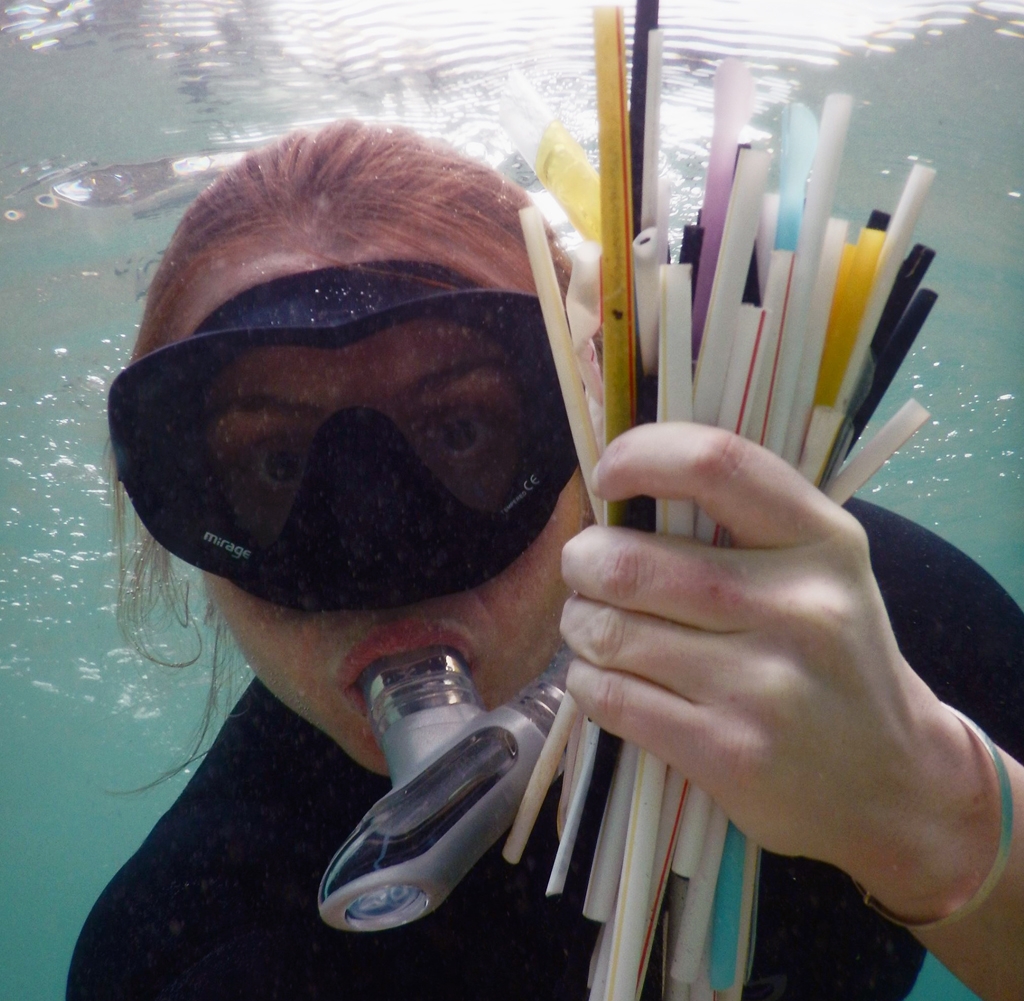 Kasey snorkelling and collecting straws